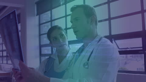 Doctors Analyzing X-ray with Modern Digital Interface