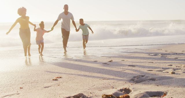 Happy Family Running on Beach Together, Enjoying Summer Vacation - Download Free Stock Images Pikwizard.com