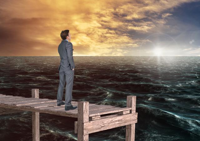 Businessman in a suit stands alone on a wooden bridge extending into the ocean, watching the sunrise. The scene suggests themes of reflection, decision-making, and solitude. This can be used for business concepts, leadership insights, or introspective life achievements visuals.