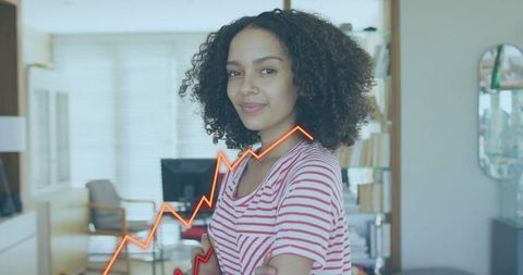 Confident woman crossing arms in home office with rising growth chart overlay