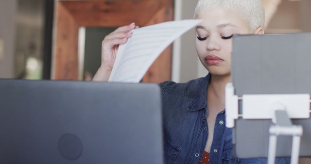 Focused Woman with Short Hair Reviewing Documents at Home Office - Download Free Stock Images Pikwizard.com