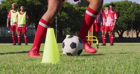 Youth soccer training drills with football and cones