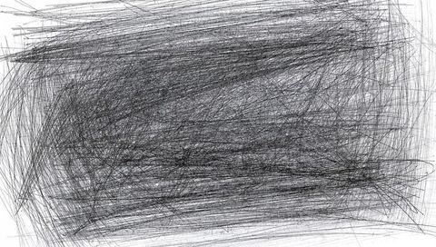 Chaotic abstract scribble on paper with monochrome textures