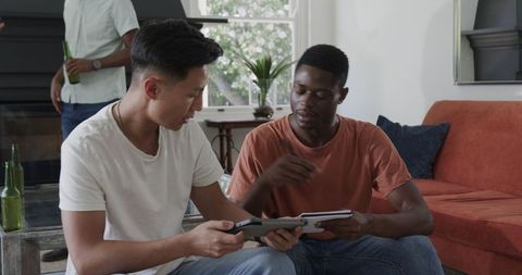 Diverse Group Collaborating on Plans at Home