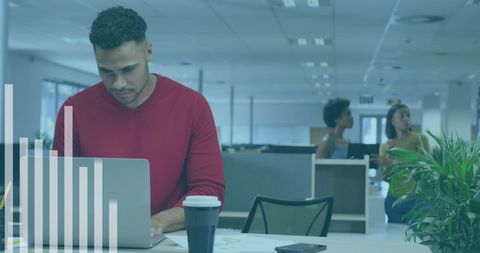Focused business team analyzing financial data in office