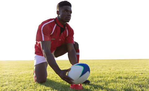 Transparent determined rugby player setting ball for kick