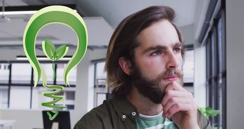 Thoughtful businessman with eco-friendly innovation symbol