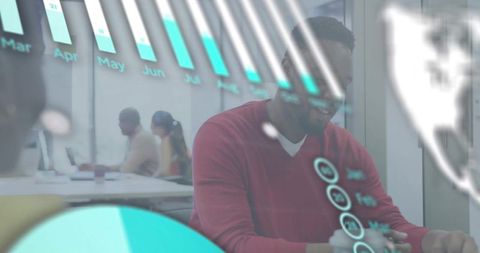 Business professional collaborating with holographic data visualization in modern office