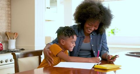 Mother Facilitating Son's Homework at Home