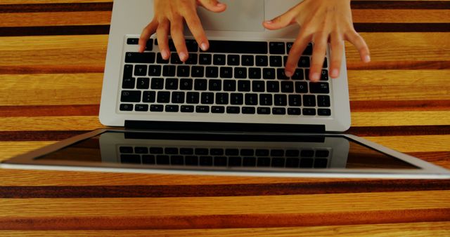 Hands Typing on Laptop Keyboard on Wooden Desk - Download Free Stock Images Pikwizard.com