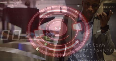 African American Businessman Gesturing with Phone Using Futuristic Red HUD at Expo Counter