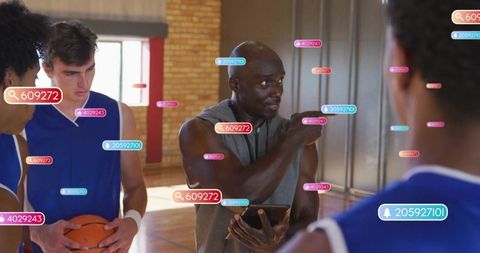 Coach using technology for player training on basketball court