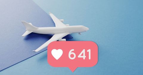 Miniature airplane with social media like icon on blue background