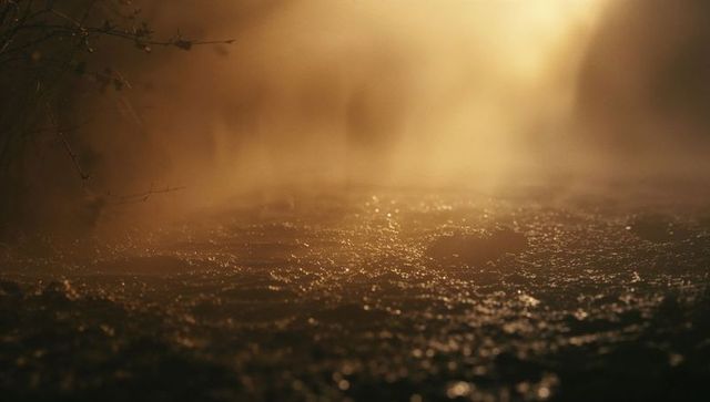 Tranquil Mist-Covered River Surface at Dawn