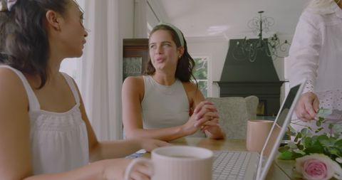 Granddaughter Discussing Wedding Plans with Grandmother at Home