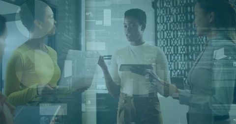 Diverse team collaborating with tablets and data dashboards in modern office presentation