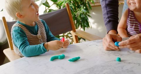 Father and Children Enjoying Creative Clay Play at Home