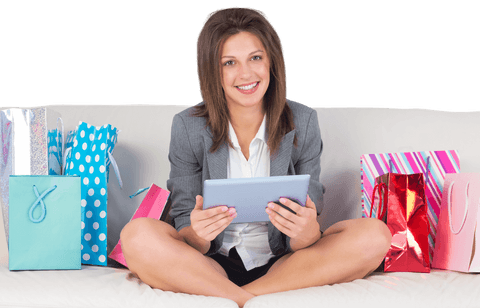 Smiling Woman Enjoying Online Shopping with Tablet in Living Room on Sofa Transparent
