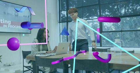Team collaborating in modern office with neon augmented reality overlays