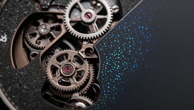 Macro watch movement revealing interlocking gears jeweled bearings and textured dial edge