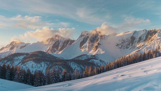 Sunset Over Majestic Snow-Covered Mountains with Evergreen Trees