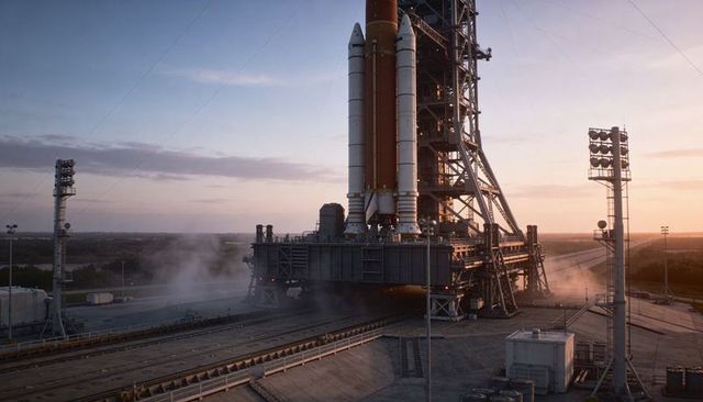 Sunrise Rocket Stack Standing on Crawler Transporter at Launch Pad with Steam and Gantry