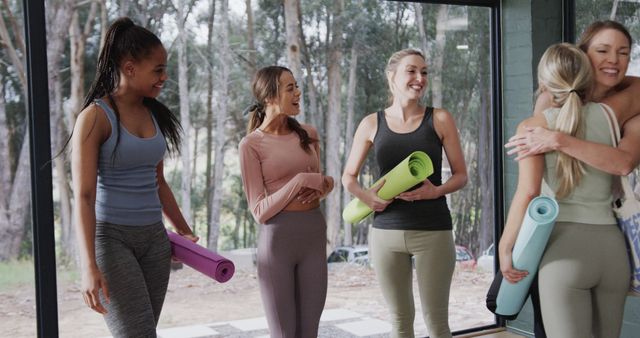 Women Bonding After Yoga Class Holding Mats in Studio - Download Free Stock Images Pikwizard.com