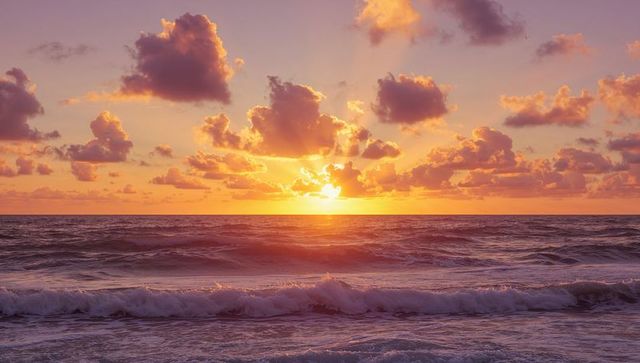 Golden Sunrise over Ocean with Vibrant Clouds