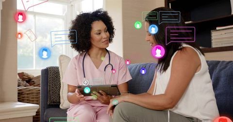 Clinician consulting patient on tablet in living room with telehealth chat graphics