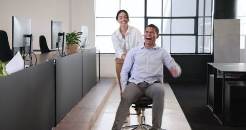 Energetic colleagues enjoying office break together