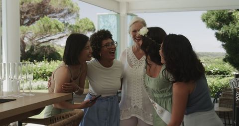 Joyful bachelorette party outdoor celebration with laughter