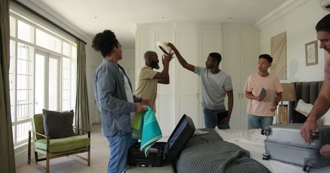 Friends Packing Luggage for Celebration Together