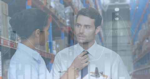 Business professionals analyzing data in modern warehouse