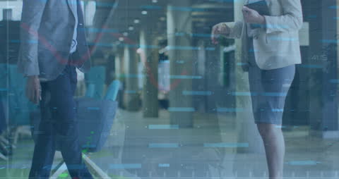 Business Professionals Analyzing Financial Data with Mixed Digital Overlay