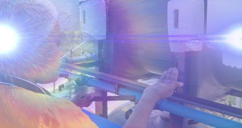 Serene Moment as Woman Washes Hands with Vivid Lens Flares