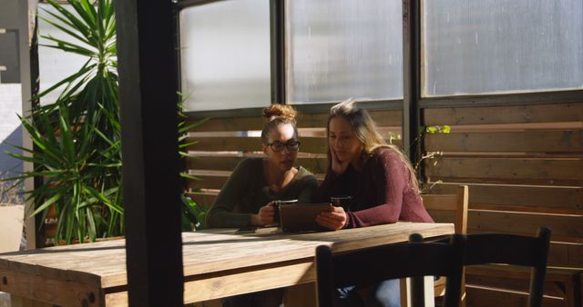 Two Women Collaborating on Digital Tablet Indoors - Download Free Stock Images Pikwizard.com