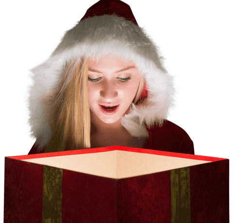 Festive woman in santa hat gazing into glowing gift with wonder