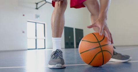 Close-Up of Basketball Player Dribbling on Indoor Court - Download Free Stock Images Pikwizard.com