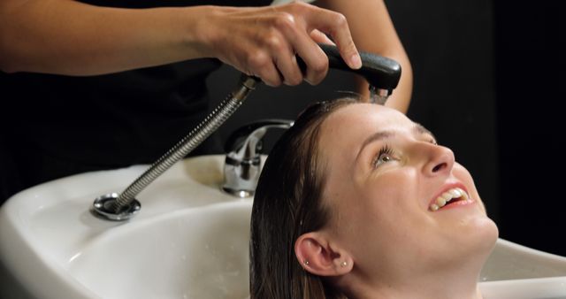 Smiling Woman Getting Hair Washed in Salon - Download Free Stock Images Pikwizard.com