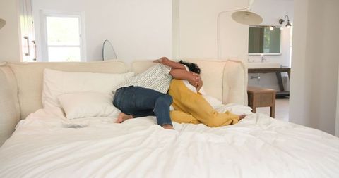 Surprised woman joyfully laughing during romantic proposal