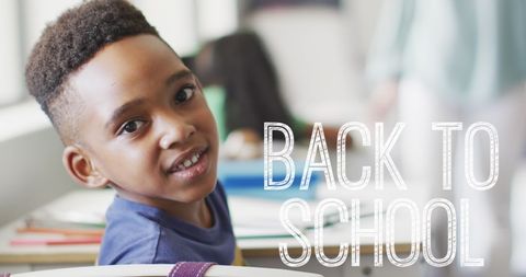 Smiling African American Schoolboy at Back to School Desk - Download Free Stock Images Pikwizard.com