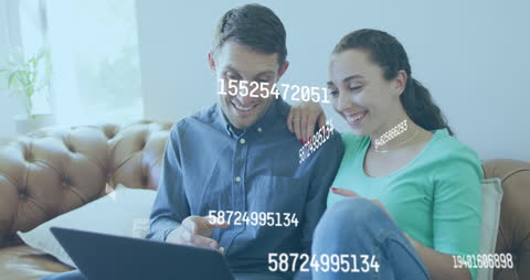 Happy Couple Engaged in Online Financial Management