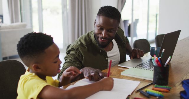 Happy Father Helping Son with Homework at Home - Download Free Stock Images Pikwizard.com