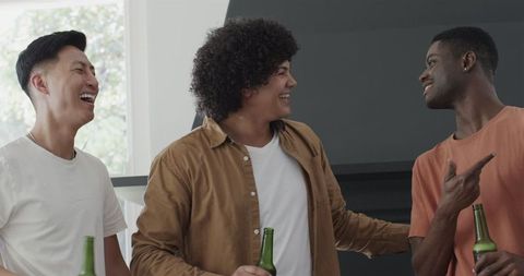 Joyful Friends Bonding with Drinks at Party