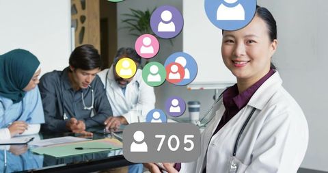 Chinese Female Doctor Using Tablet in Healthcare Meeting Room