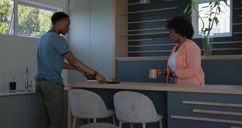 Couple in Modern Kitchen Enjoying Coffee Break Together