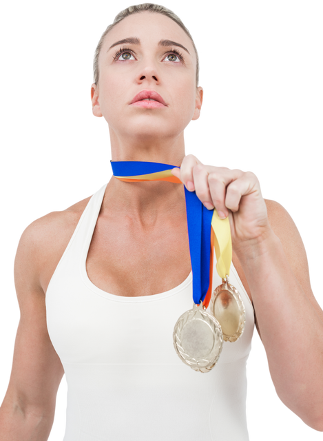 Confident Female Athlete Celebrating Victory with Medals - Download Free Stock Videos Pikwizard.com