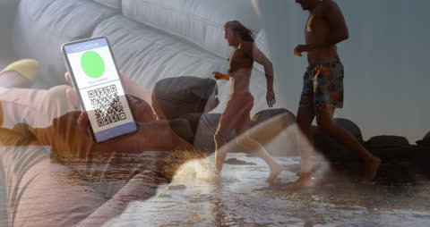 Covid Passport in Focus with Happy Friends on Beach