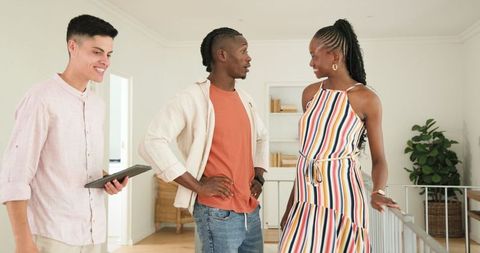 Friends Laughing and Connecting at Home with Digital Device
