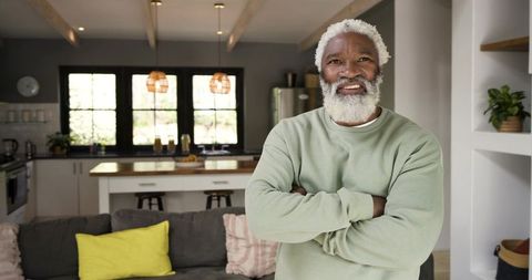 Senior Male Relaxing in Contemporary Kitchen Lounge Environment